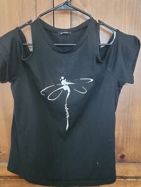 Just Fashion Now Black Off-Shoulder Tee with White Dragonfly "Warrior" Print